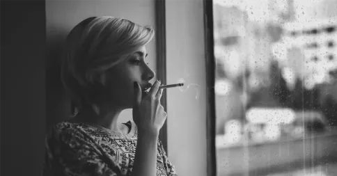 woman smoking to calm her adhd